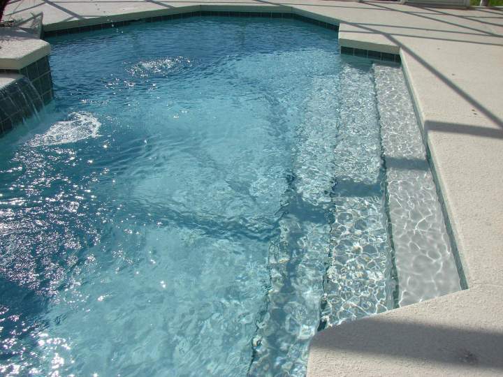 Pose carrelage sol piscine Idron